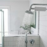 Modern shower with an inline shower filter attached to the shower arm
